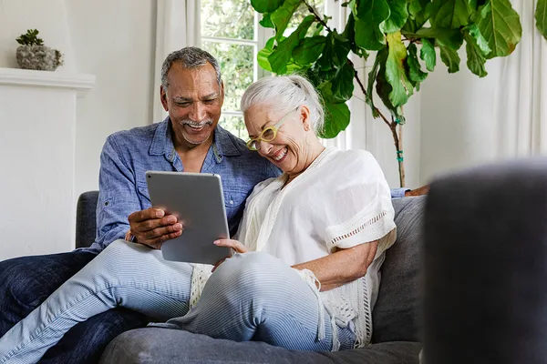 happy couple on tablet