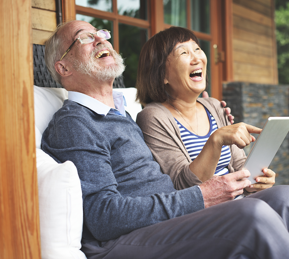 happy couple on tablet
