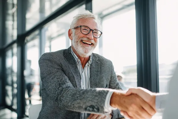 laughing man shaking hands