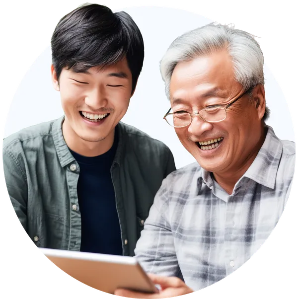 elderly and younger man smiling at a tablet