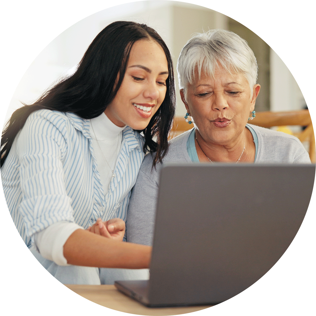 woman on phone with laptop