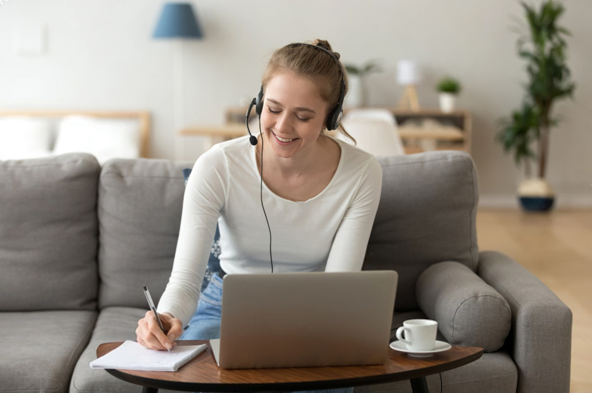 woman on couch with laptop