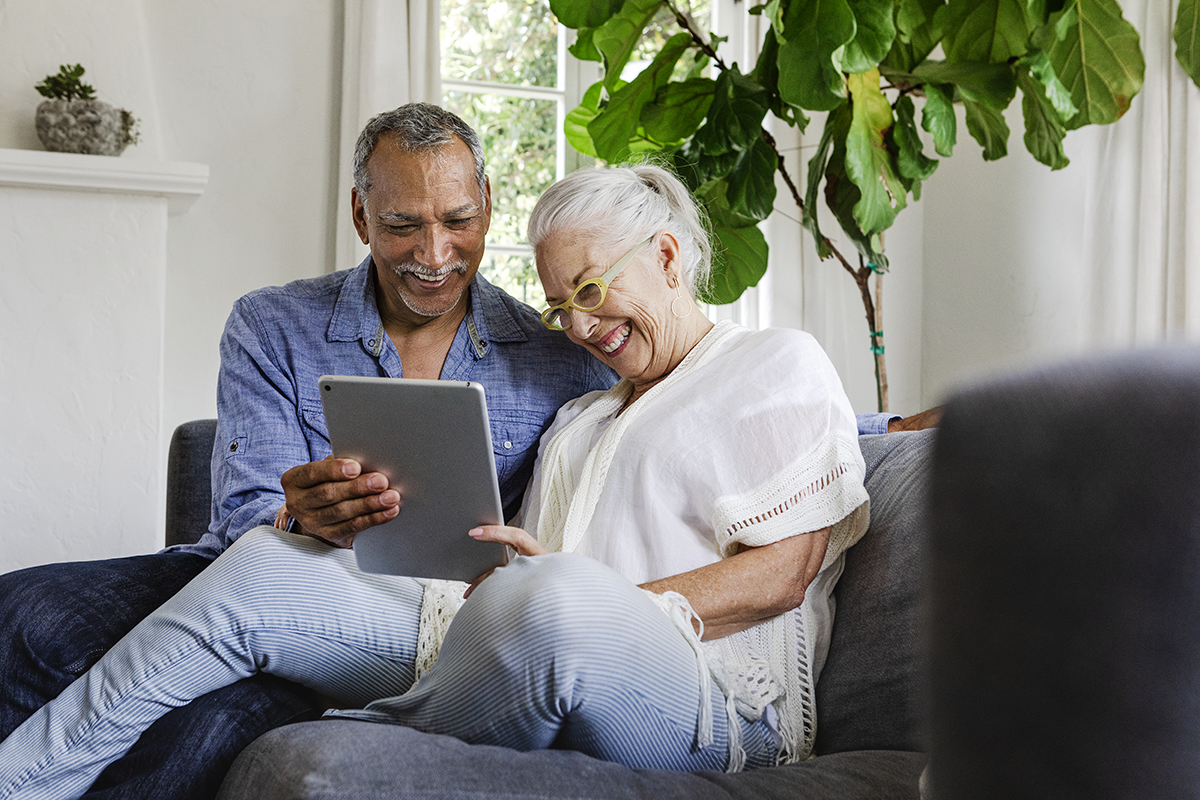 happy couple on tablet